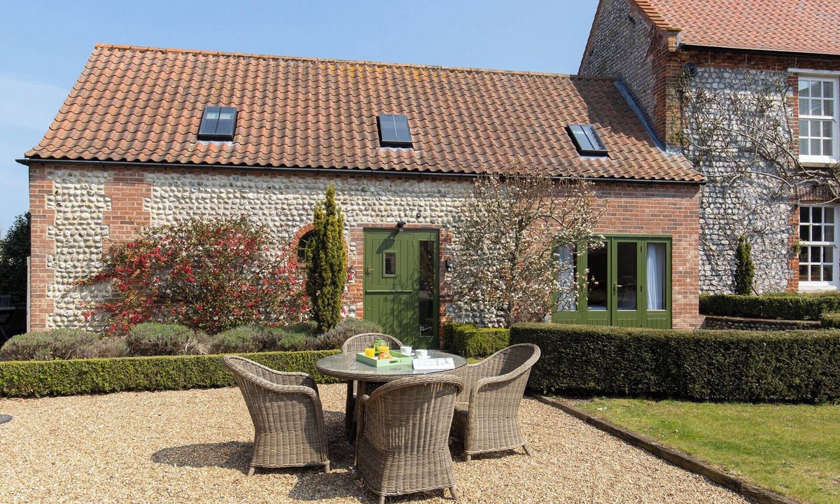 West Beckham Cottage | Open plan living accommodation with bi-fold doors.