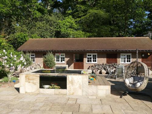 Sway House | The Stables - 2 bed with large garden and hot tub.