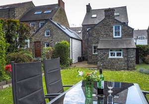 Spacious cottage in the heart of St Davids overlooking cathedral with parking .