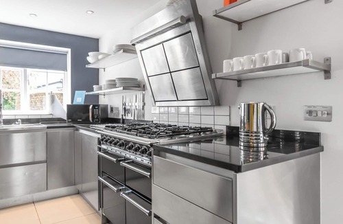 Stoke Ferry House | 7 Storey Listed Windmill, dog friendly with outdoor pool & bbq