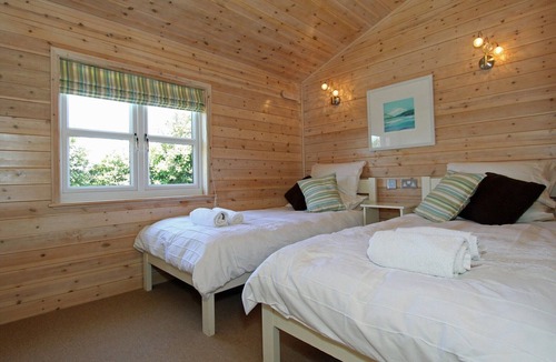 St Merryn Cabin | A light and spacious lodge with one double with walk in wardrobe and en-suite shower and one twin.