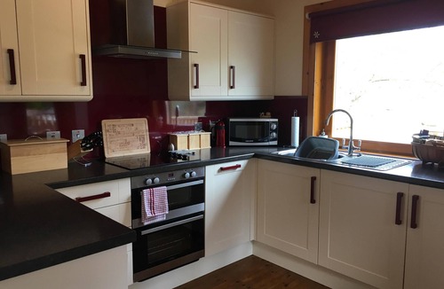 Torlundy Ski Chalet | Burnside Lodge, overlooking river Lundy, backdrop of Ben Nevis and Nevis Range.