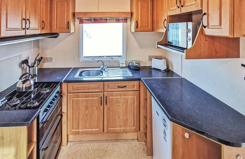Llanllwchaiarn House | Comfortable caravan with one double and two twin.