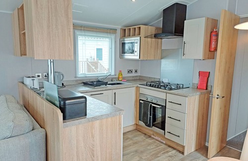 Ryther House | Comfortable caravan with one double with en suite shower room, and one twin.
