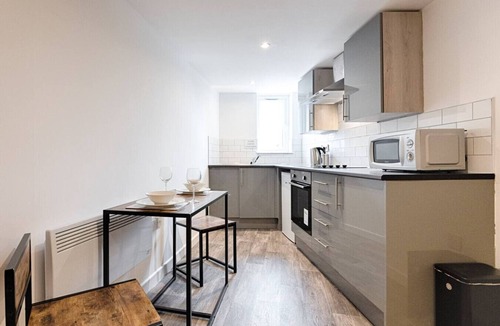 Landore Condo | Contractor Base Kitchen Parking Included