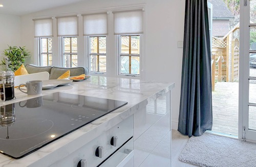 Mayfield Cottage | Elegantly finished lodge with a private, decked garden.