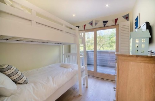 Talland House | Fabulous property with extensive roof terrace, reached by a spiral staircase, affords panoramic view