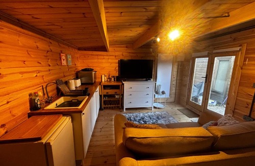 Mortimer West End Apartment | Log Cabin
