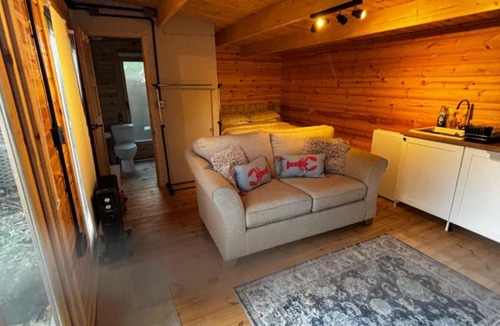 Mortimer West End Apartment | Log Cabin