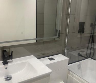 Stanwell Apartment | Lovely Modern studio flat with jacuzzi bath free parking