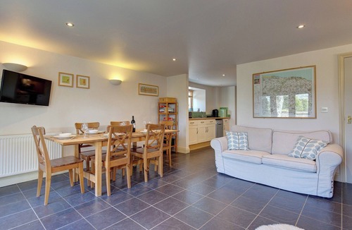 West Beckham Cottage | Open plan living accommodation with bi-fold doors.