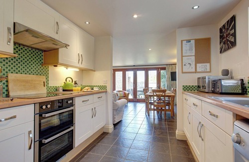 West Beckham Cottage | Open plan living accommodation with bi-fold doors.