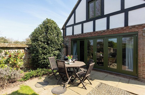 West Beckham Cottage | Open plan living accommodation with bi-fold doors.