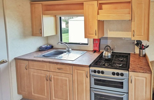 Aberystwyth House | Spacious 12ft-wide caravan with one double and one twin.