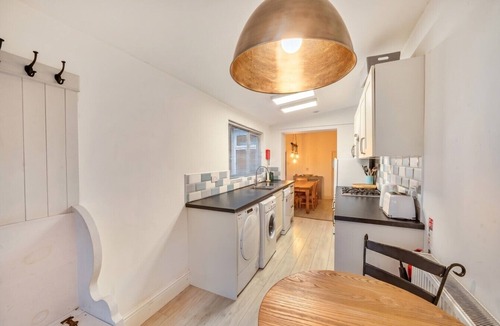 Muston Cottage | Spacious coastal cottage with enclosed garden and fireplace
