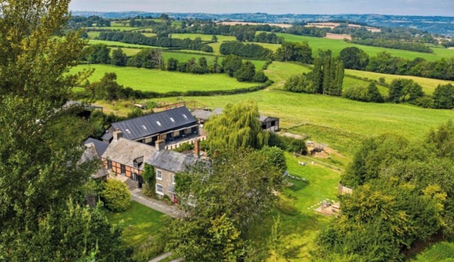 Set within three acres of private gated grounds, Wisteria House enjoys stunning views across the Wye Valley.